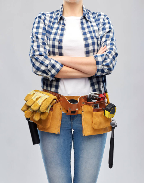 woman or builder with working tools on belt - Zdjęcie, obraz