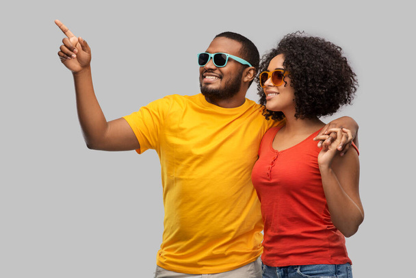 happy african american couple in sunglasses - Фото, изображение