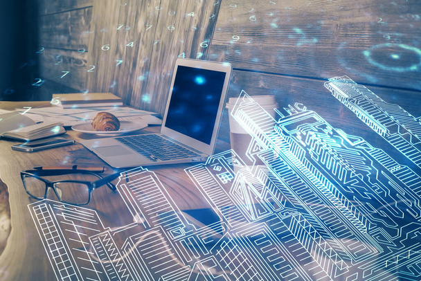 Desktop computer background in office and big town buildings hologram drawing. Double exposure. Smart city concept. - Foto, imagen