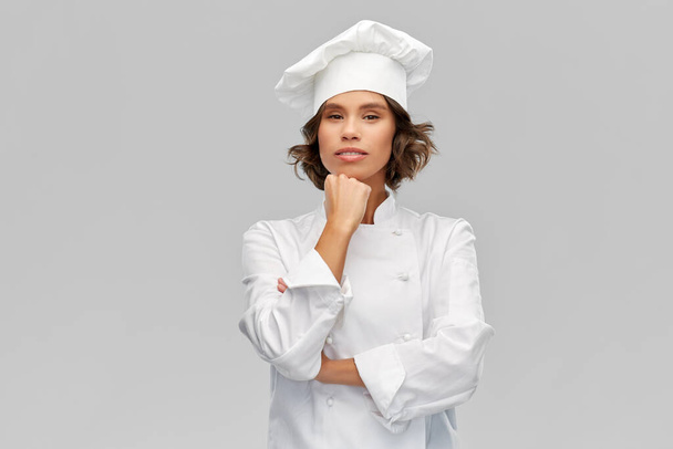 female chef in toque thinking - Foto, Imagem