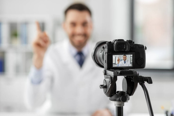 male doctor recording video blog at hospital - Zdjęcie, obraz