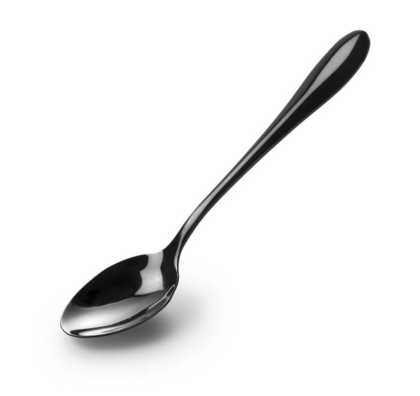 Ένα μαύρο μεταλλικό κουτάλι σε λευκό φόντο - Φωτογραφία, εικόνα