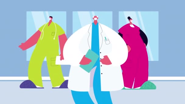 προσωπικό ιατρών που φοράει ιατρική μάσκα για covid19 σε νοσοκομειακό χώρο - Πλάνα, βίντεο