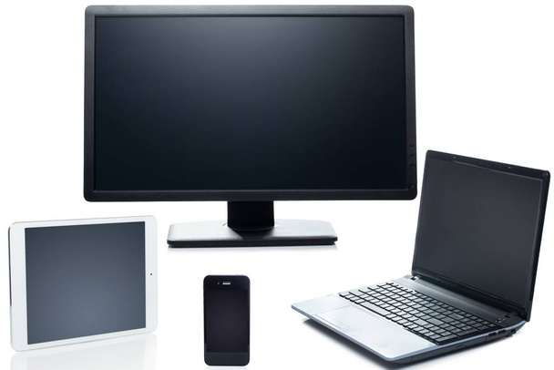 Tecnología. Ordenador portátil, tableta, smartphone y monitor en un fondo blanco
 - Foto, Imagen