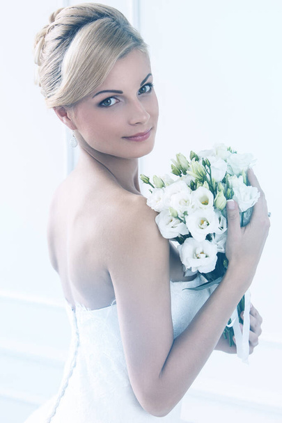 Wedding. Attractive bride with beautiful bouquet - Photo, Image