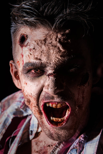 Creepy zombie on a black background - Valokuva, kuva