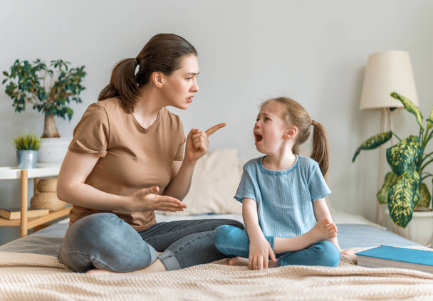 mother is scolding her child girl. family relationships - Valokuva, kuva
