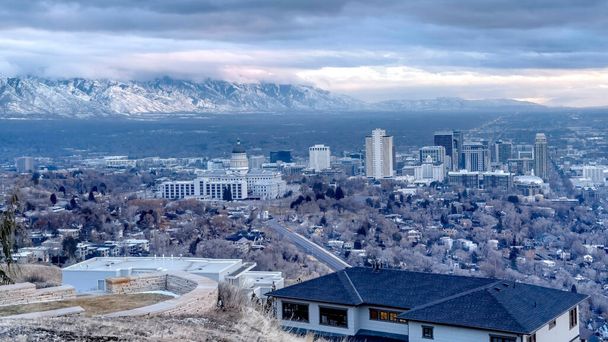 Panorama Hill overlooking downtown Salt Lake City and distant mountain dusted with snow - Photo, Image