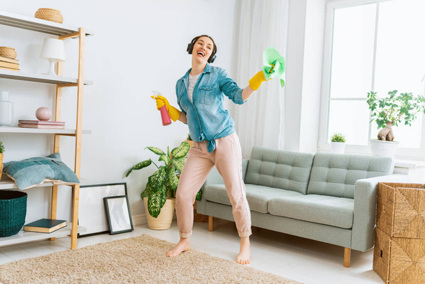 Beautiful young woman doing cleaning the house. - Φωτογραφία, εικόνα