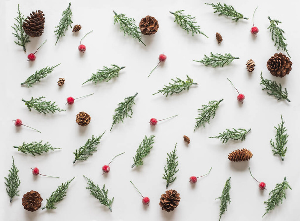 Christmas background, frame with fir branches tree pinecone over white background. flatlay copy space - Foto, immagini