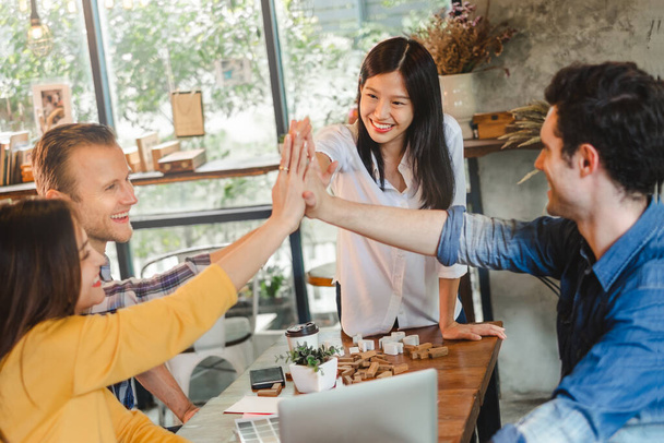 Business diversity people stacking hands for teamwork concept at cafe - 写真・画像