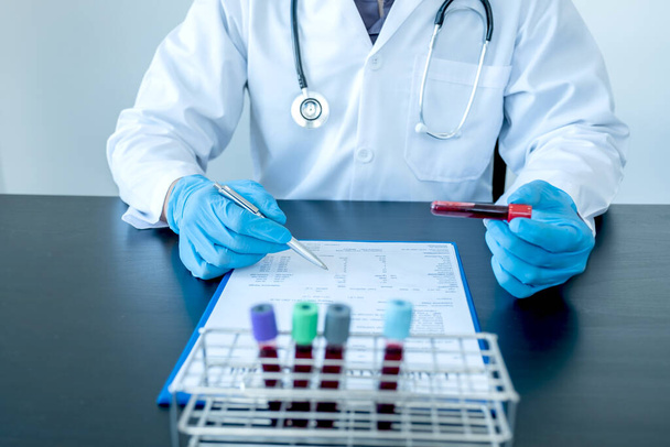 Professional doctors perform find virus tests from samples of blood tests to diagnose coronary virus infections analysis and sampling of infectious. - Photo, Image
