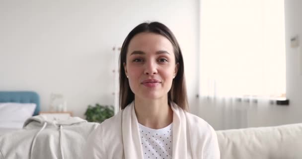 Smiling 20s female blogger recording clothes advertising video. - Кадри, відео