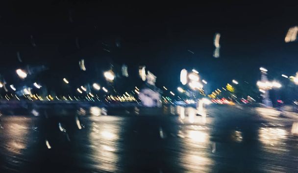 Escena nocturna abstracta en París, Francia, luces borrosas por movimiento
 - Foto, imagen