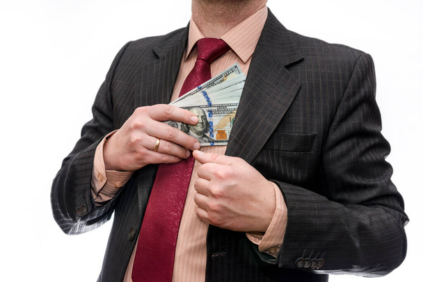 Férfi kezek dollárbankjegyekkel a zsebükben - Fotó, kép