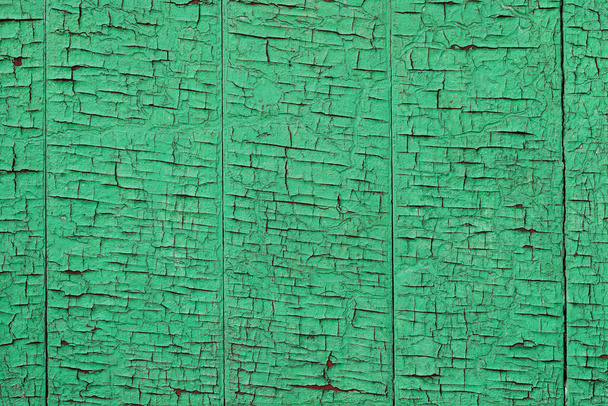Background texture of wood surface with peeling green paint - Foto, afbeelding