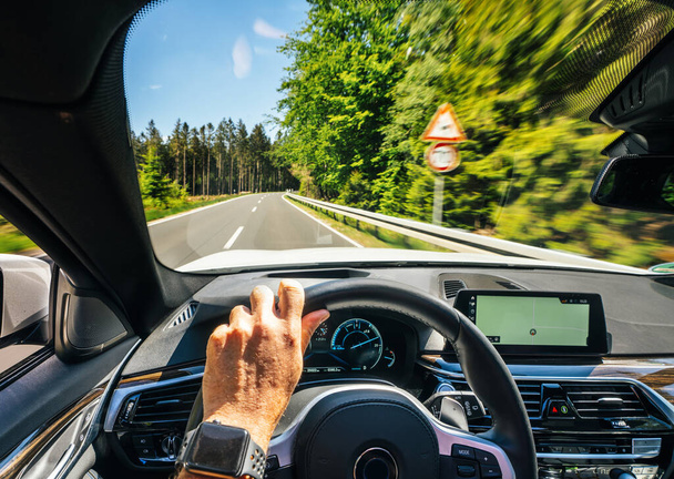 hands of car driver on steering wheel, road trip, driving on highway road - Valokuva, kuva