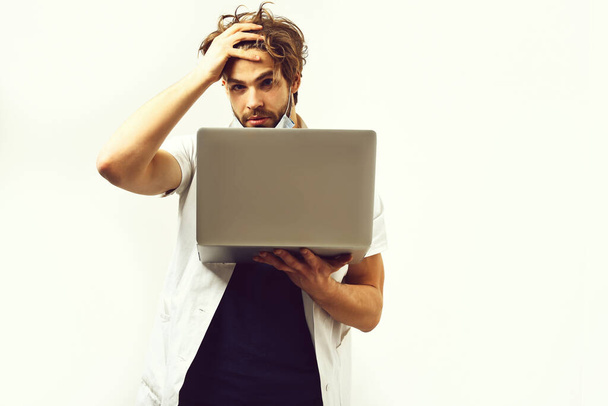 Bearded caucasian doctor or postgraduate student with laptop in mask - Foto, Imagem