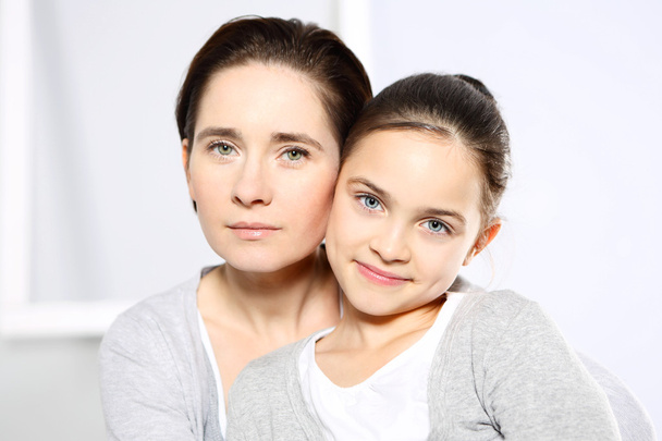 Beautiful young girl with her mother - Fotografie, Obrázek