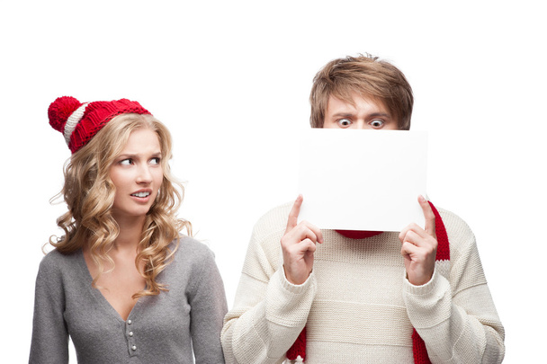 young funny christmas couple holding sign - Foto, Bild