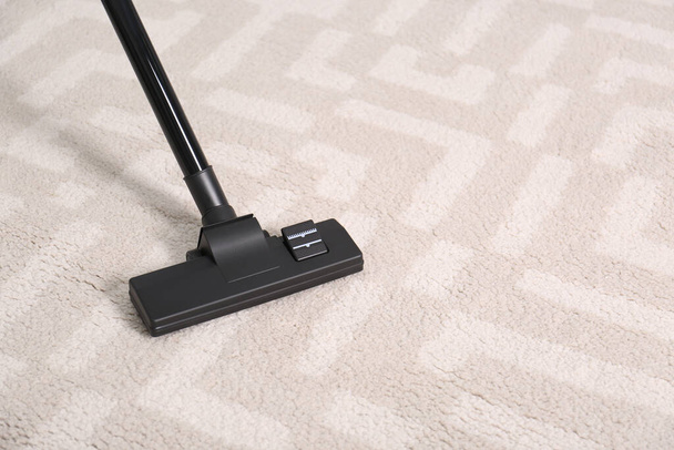 Hoovering floor with modern vacuum cleaner, closeup. Space for text - Foto, immagini