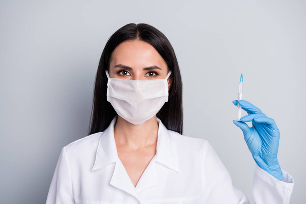 Close-up portrait of her she nice attractive girl expert specialist doc therapist treating grippe flu flue infection symptom syndrome making prick isolated over grey pastel color background - Foto, Bild