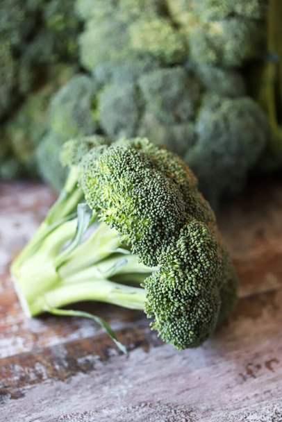 Fresh broccoli heads. Vegan diet concept. Benefits of eating broccoli. - 写真・画像
