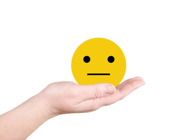 Yellow smiley on the palm on white background - 写真・画像