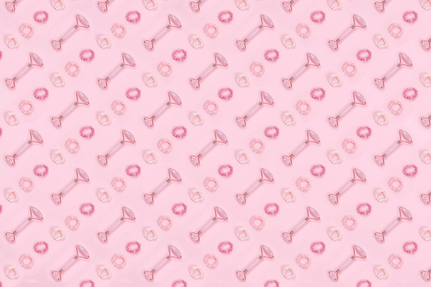 Pattern of jade roller and pink hair accessories - Photo, Image