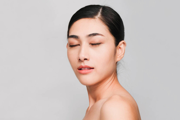 Face of Young beautiful asian woman with clean, fresh and bright skin, Happiness and cheerful with positive emotional,isolated on gray background,Beauty Cosmetics and Facial treatment Concept - Foto, imagen