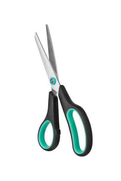 Silver metal open scissors with black plastic handles on white background isolated close up, steel cutting tool for paper, fabric clippers, hair shears, tailor pair of scissors, nobody, studio shot - Photo, Image