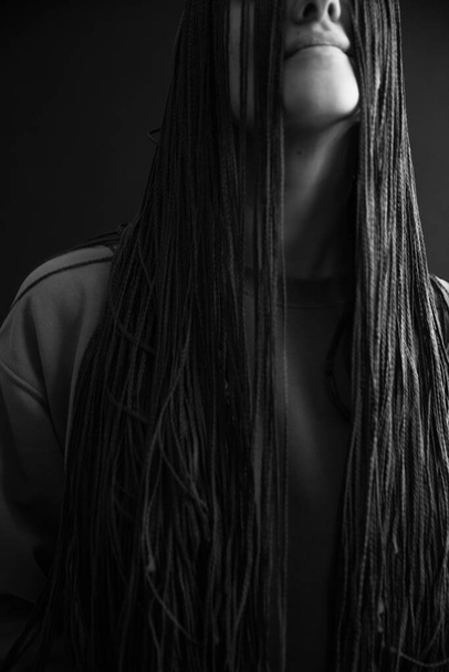 Details of body black and white portrait of beautiful girl, fashion and art,afro pigtails, pigtails, dreadlocks - Photo, image
