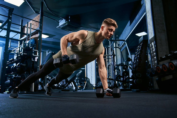 Muscular man doing push ups on one hand. - Valokuva, kuva