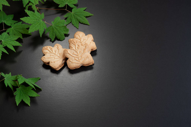 Maple cookies and  maple leaves in spring. canadian food concept - Photo, Image