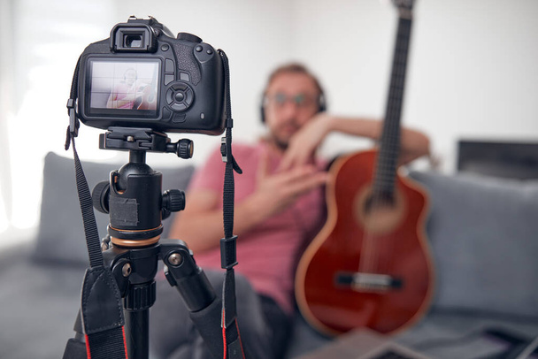 Guitarist making video lessons and tutorials for internet vlog website classes. - Fotografie, Obrázek