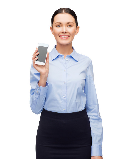 Smiling businesswoman with spartphone blank screen - 写真・画像