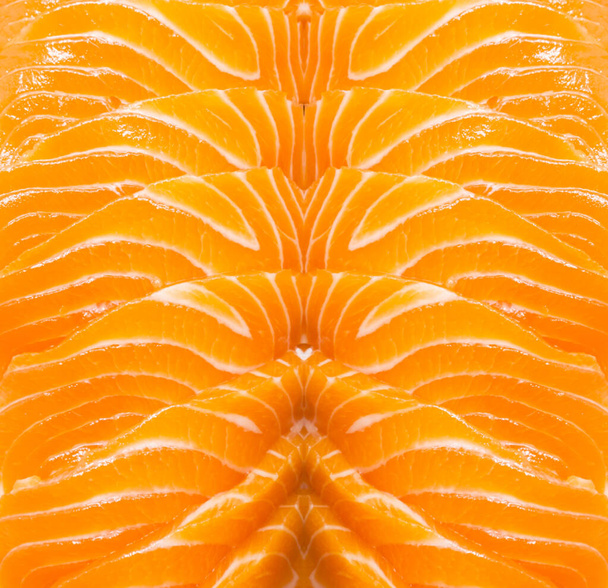 Pattern in rows of Salmon Sashimi sliced, salmon is a high omega-3 fatty acids, protein and vitamin, top view photo - Foto, immagini
