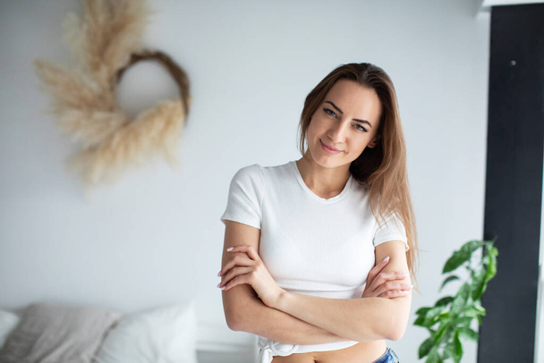 Young beautiful woman at home. Female portrait. - Foto, afbeelding