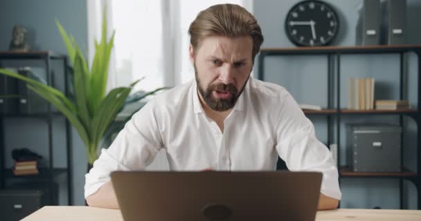 Confident businessman having video chat at modern office - Filmagem, Vídeo