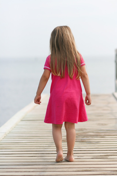 Young Girl at Beach Pier - Фото, зображення