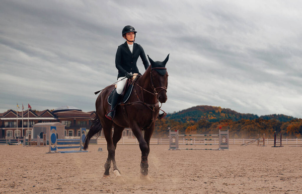 Equestrian sport. Woman riding horse. - Photo, Image