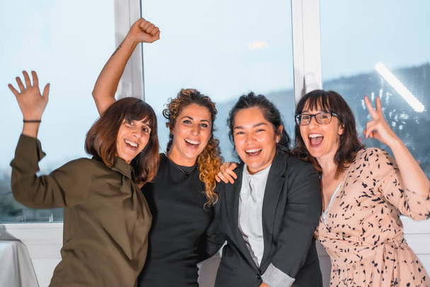four female colleagues having fun in office  - Foto, Bild