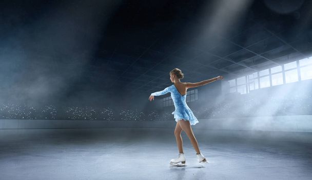 Young woman figure skating. - 写真・画像