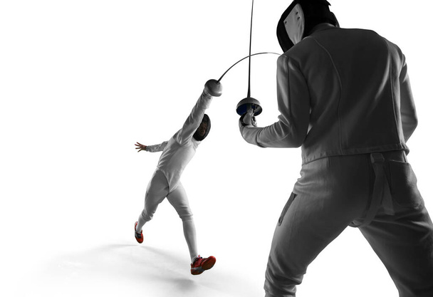 Two young men fencing. - Valokuva, kuva