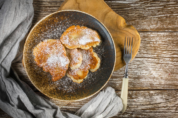 Sweet pancakes made of apple, milk and flour. Top view. - Fotó, kép