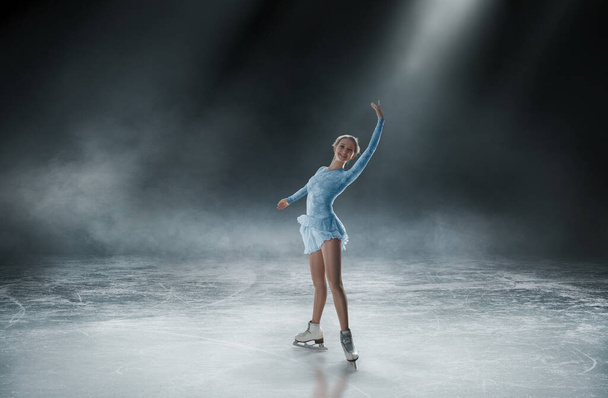 Young woman figure skating. - Photo, Image