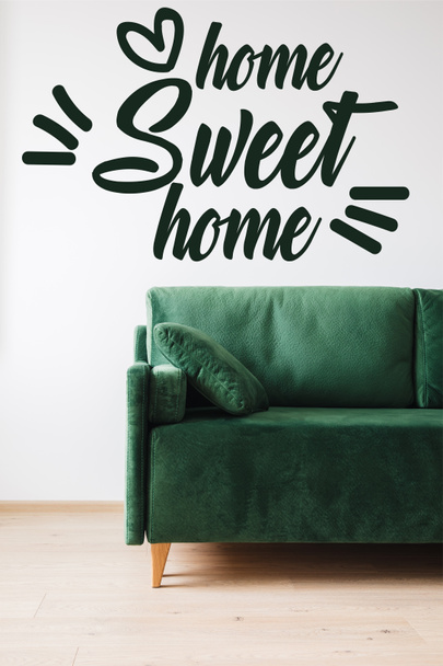 green sofa with pillow near home sweet home lettering  - Photo, Image