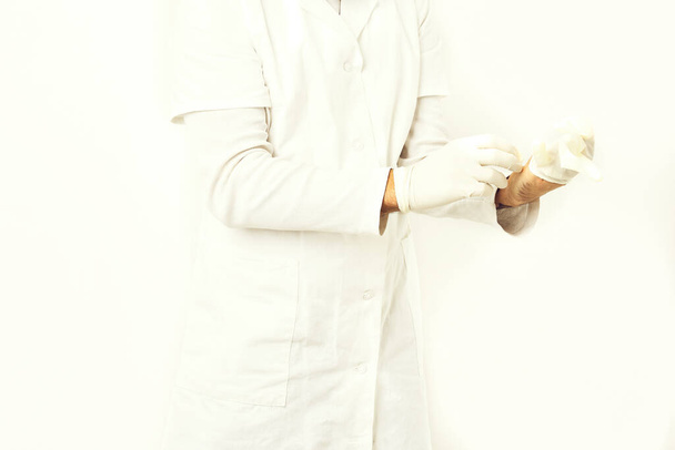 Male hands of doctor wearing medical gloves - Foto, Bild