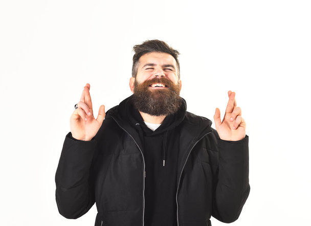 Man with beard and closed eyes crosses fingers, gesture - Photo, Image