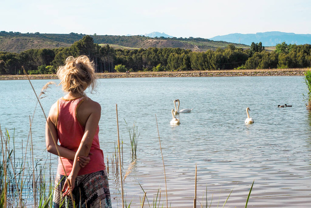 woman next to wild ducks - Photo, Image